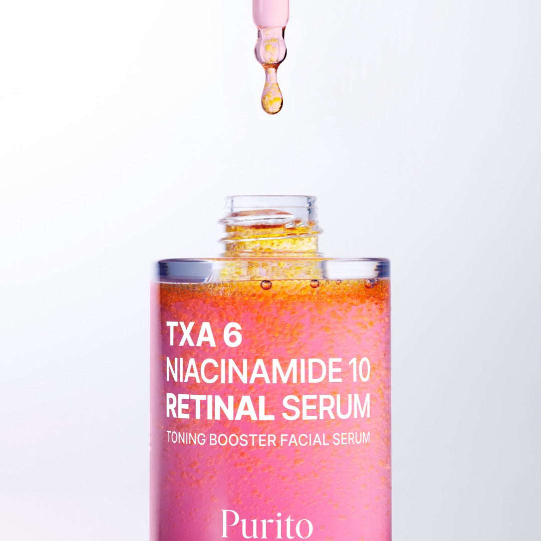 Purito TXA 6 Niacinamide 10 Retinal Serum bottle with dropper on a white background